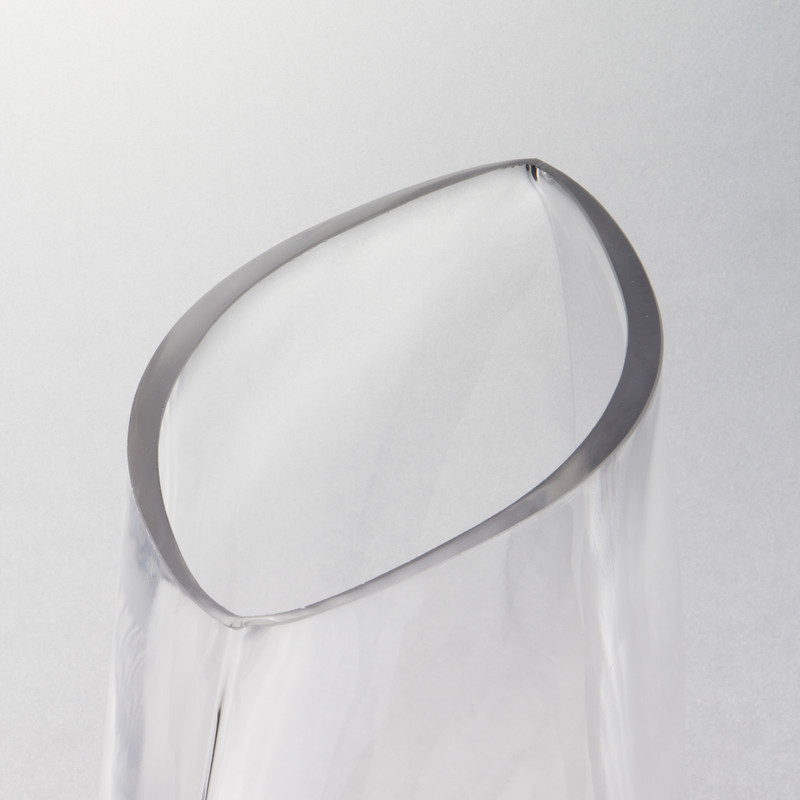The Glass Oval Vase: Marvel at these natural curves that beckon the eye for a closer look.
