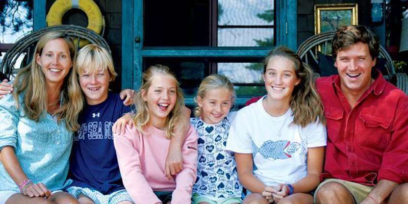 Tucker Carlson and wife Susan Andrews with their four children