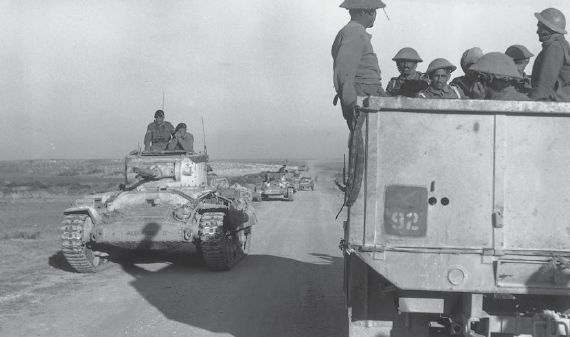 Columna blindada británica avanzando hacia Efindaville. A la derecha tropas indias sobre un camión. Abril de 1943